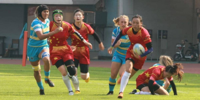 China win first playoff game against Kazakhstan